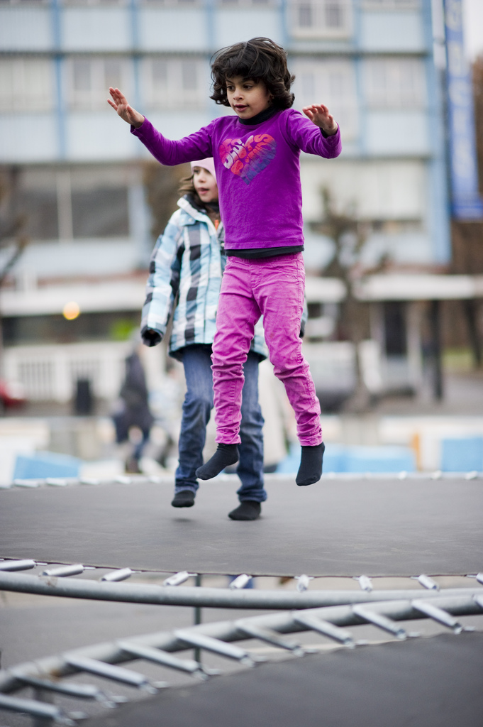 Girl jumping on a trampoline